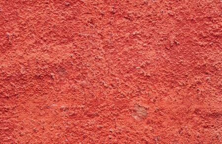 painted red plastered concrete wall. abstract red texture background.の写真素材