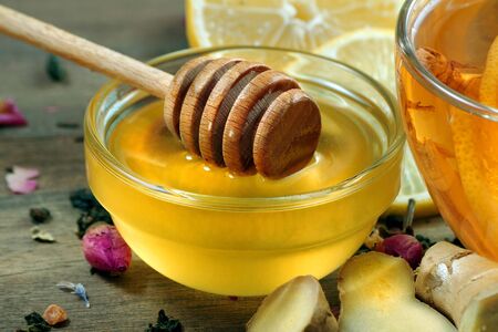 honey, lemon and a cup of tea. traditional cold remediesの写真素材