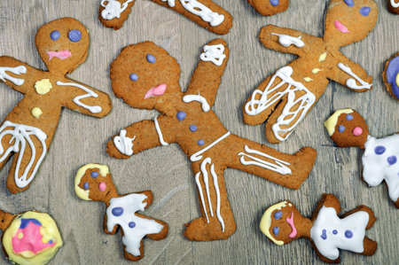 Gingerbread man cookies on a wooden table. top view. Christmas and New Year holiday background....