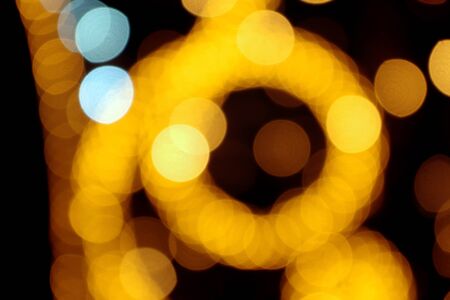 yellow blurry lights. Christmas lights, city festive garlandsの写真素材