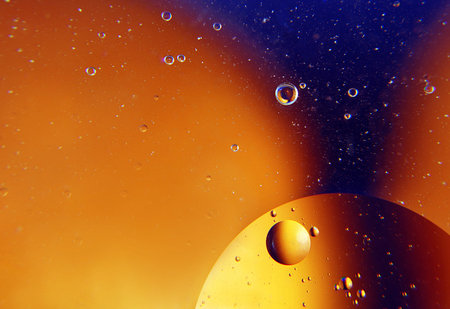 abstract space background. drops of oil in water. abstract orange background