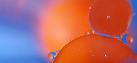 abstract space background. drops of oil in water. abstract orange and blue background. copy space