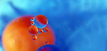 abstract space background. drops of oil in water. abstract orange and blue background. copy space