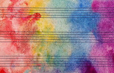 Colors of rainbow. Melody concept. Old music sheet in colorful watercolor paint. Music concept. Abstract colorful watercolor background.の写真素材