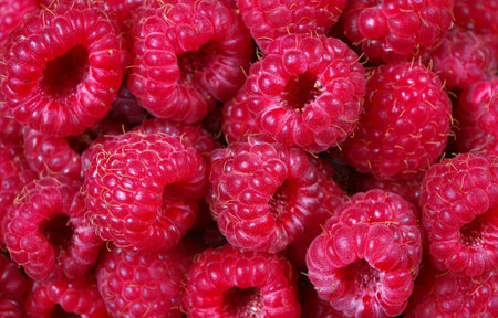 fresh ripe raspberries in a wooden spoon. summer healthy berries. close up