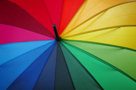 colors of rainbow. multicolored umbrella close-up. rainbow umbrellaの写真素材