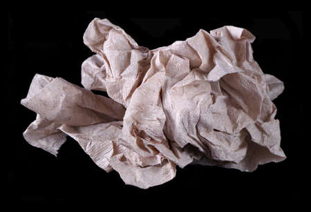 crumpled paper isolated on blackの写真素材