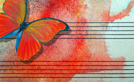 Red butterfly and notes. Butterfly melody. Photo of old music sheet in red watercolor paint. Abstract watercolor background.の写真素材
