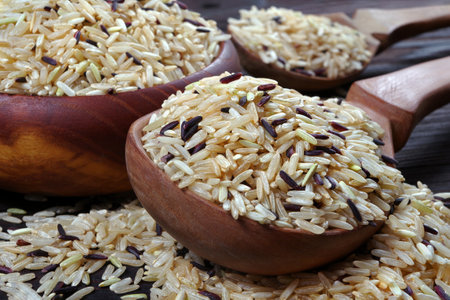rice in a wooden spoons close-up. wild brown riceの写真素材