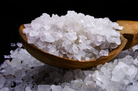 natural spices. sea salt in a wooden spoon. close up