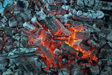 Coals and flames. Hot coals texture background