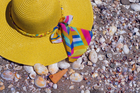 yellow beach hat on the sea sand. beach concept