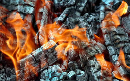 Coals and flames. Hot coals texture background