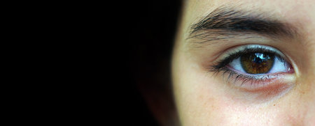 brown eyes girls close-up. copy spaceの写真素材