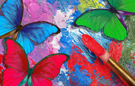 color concept. bright tropical morpho butterflies on an artist's palette. art paints and butterflies...