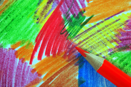 red pencil on colored paper. strokes with pencils on paper. abstract multicolored drawing with...