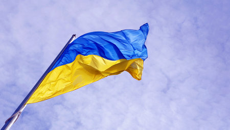 yellow - blue flag of Ukraine against the sky. copy space