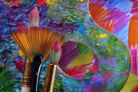 brushes and artist's palette, background for design.の写真素材