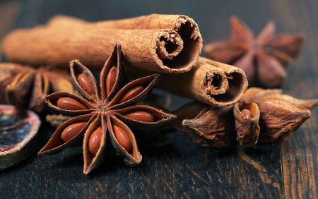 anise star and cinnamon on a wooden table close up.の写真素材