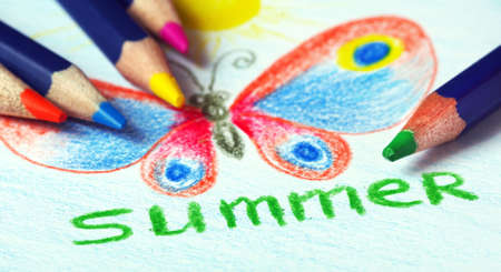 children's drawing with colored pencils. drawing of a bright tropical butterfly with pencils.の写真素材