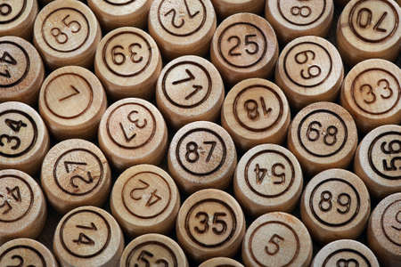 Lotto game. Wooden lotto barrels background. close up. top viewの写真素材