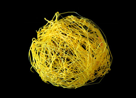 yellow plastic ball isolated on black