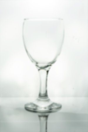 Empty wine glasses blur on a gray background.の写真素材