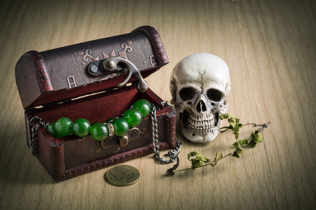 Treasure chest old with Jewelry and human skull. Still life.の写真素材