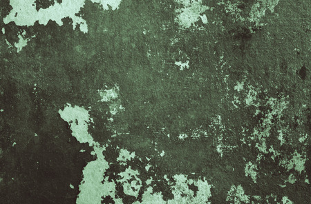 Wooden wall with black paint is severely weathered and peelingの写真素材