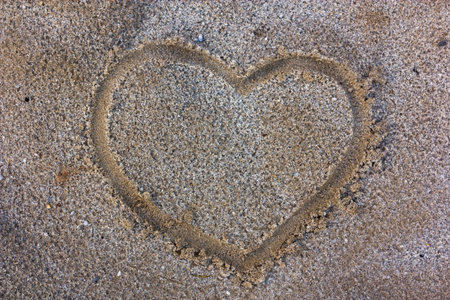 Heart on sand.