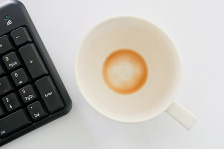 Cup of coffee and computers.の写真素材