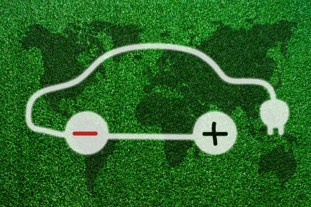 Symbol of the electric cars on the grass.の写真素材