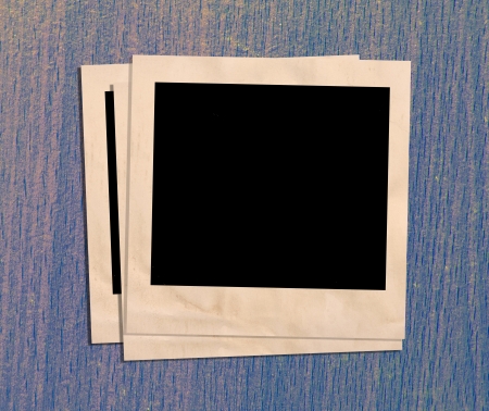Vintage photo frames on wood.の写真素材