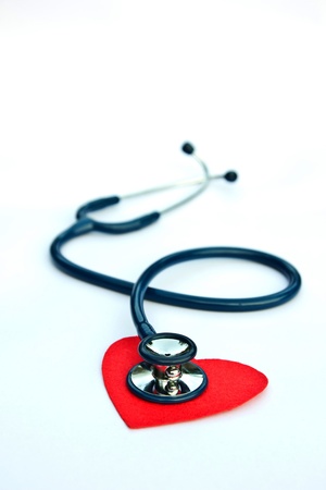 Stethoscope and heart on a white background.の写真素材