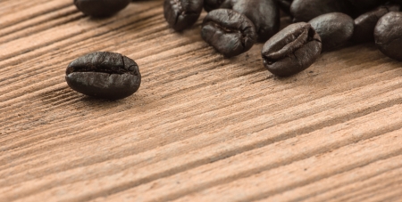 Coffee beans closeup on wooden floors.の写真素材