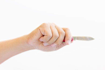 Hand holding a knife.の写真素材