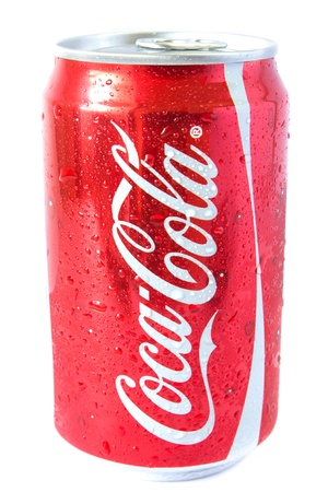 A shiny red can on coke or coca cola with a silver pop top covered with water droplets. A shiny red can on coke or coca cola with a silver pop top covered with water droplets.