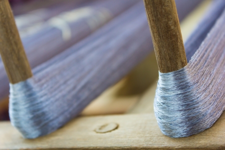 Silk thread and wooden stickの写真素材