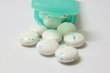 Gum from green gum box and white background