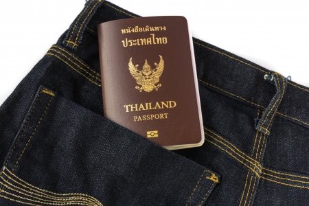 Thailand Passport in blue jeansの写真素材
