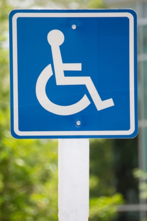 Blue wheelchair sign on the postの写真素材
