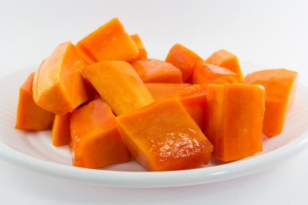Delicious Chopped Ripe Papaya Fruit On White Backgroundの写真素材