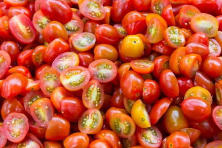Red sliced ââtomatoes backgroundの写真素材