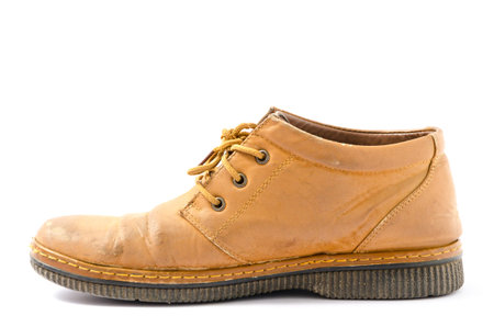 Old rustic brown leather shoes for right feet isolated on white background