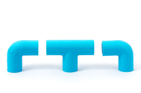 New blue plastic pvc pipe in L shape for connect 2 pipes in corner  and T Connector for connect 3 pipes in intersection isolated on white backgroundの写真素材