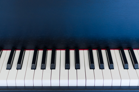 Piano key on black piano backgroundの写真素材