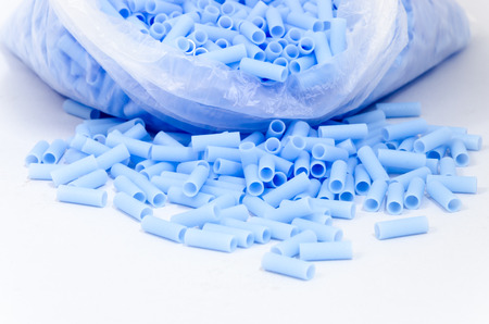 Isolated of blue plastic bead in plastic bag on white backgroundの写真素材