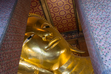Reclining buddha Wat Pho temple bangkok thailandの写真素材
