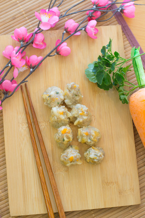 shumai, dim sum On a wooden trayの写真素材