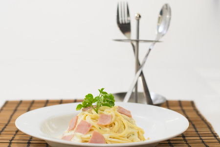 spaghetti carbonara, silverware, White backgroundの写真素材